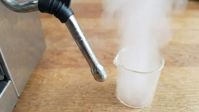 Breville steam wand showing powerful, clean, and symmetrical steam flow from all holes after successful cleaning